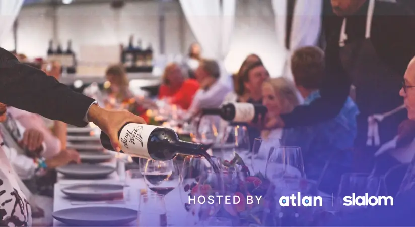 Wine being poured at a healthcare leaders dinner hosted by Atlan and Slalom.