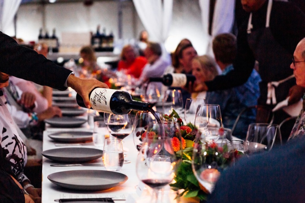 Wine being poured at a healthcare leaders dinner.