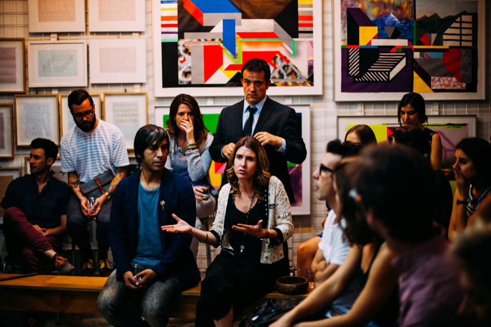 Marketing leaders in conversation at a panel reception.