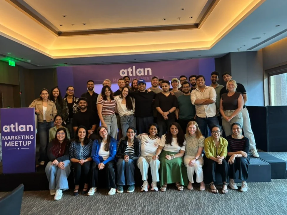 The Atlan marketing team at the marketing meetup, gathered on and around the stage.